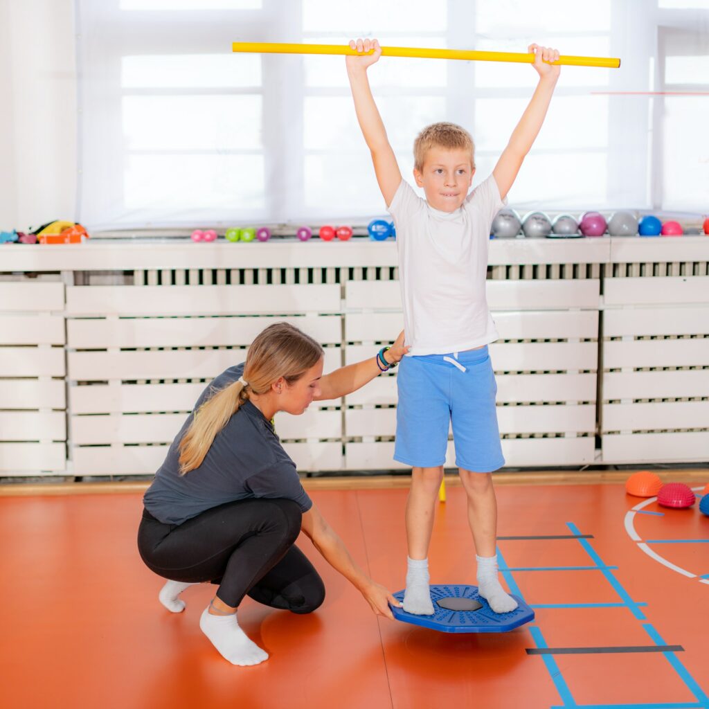 Balance exercises for children, using balancing disks